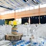Calendar day 20: a long table set for a party under a striped awning