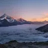 Calendar day 27: snow-capped mountains above a sea of cloud at sunrise