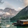 Entry thumbnail: a wooden boathouse on a still mountain lake in morning mist